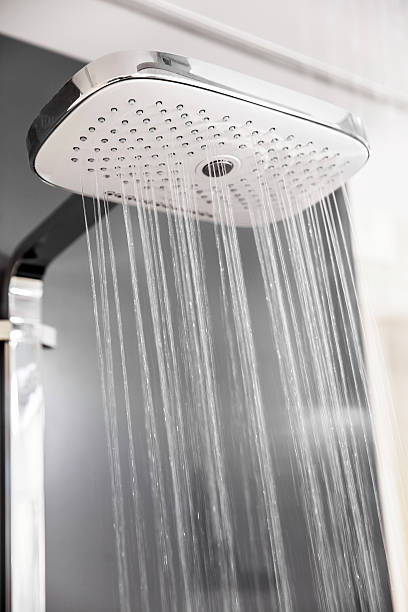 istock Shower head with sprinkling water 478635416