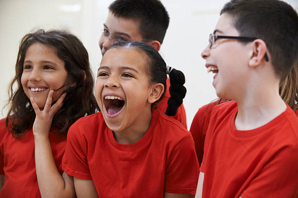 istock Group Of Children Enjoying Drama Class Together 478636388