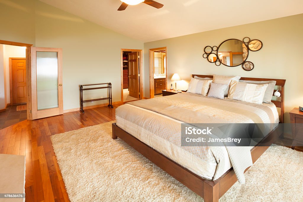 Bright Master Bedroom with Hardwood Floor Bright, Large Master Bedroom with Hardwood Floor Awe Stock Photo