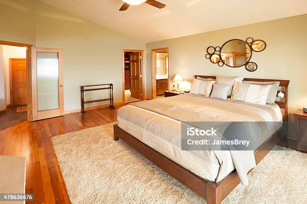 Bright Master Bedroom With Hardwood Floor Stock Photo - Download Image Now - Awe, Bed - Furniture, 2015