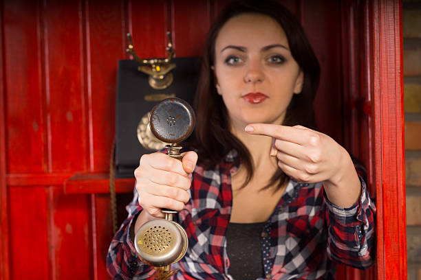 istock Young woman indicating an incoming phone call 478639150