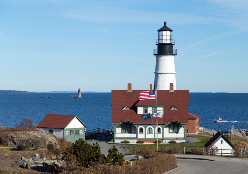This is a view of Portland Head Light.  Ram Island Ledge Lighthouse can also be seen in the background.
