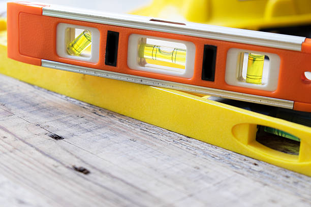 istock red and yellow building level on the wood table 478643904