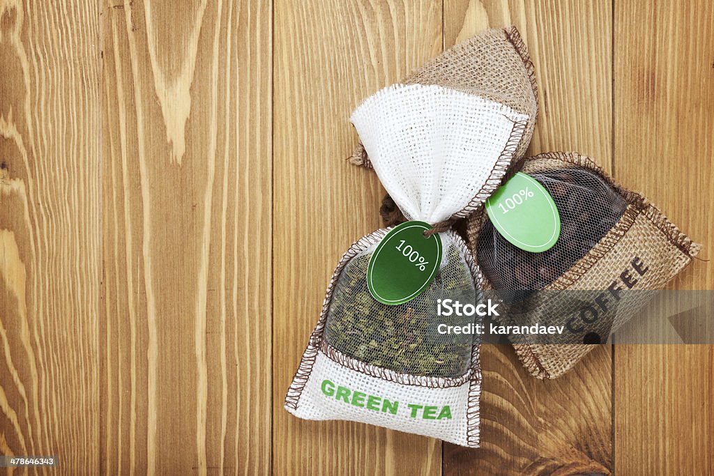 Coffee and tea small bags Coffee and tea small bags on wooden table background with copy space Above Stock Photo