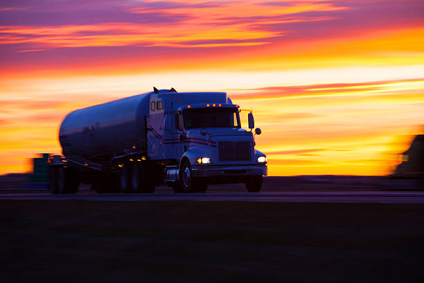istock Tanker truck speeding along a highway at sunset. 478647421
