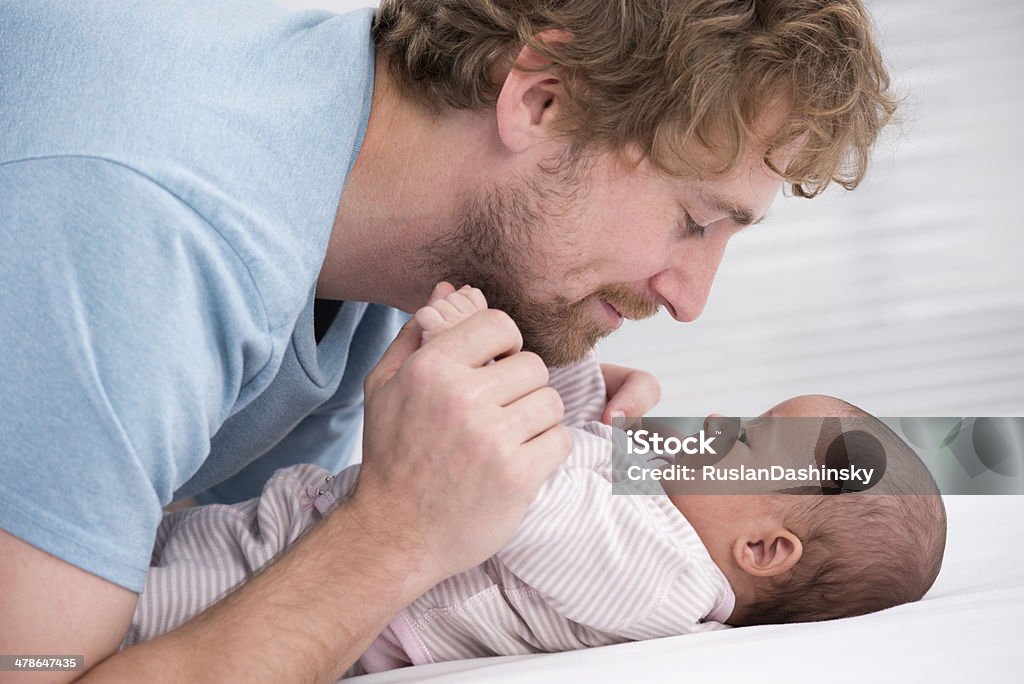 Dad and newborn baby. Father playing with his little baby. Quality time father and daughter. 0-11 Months Stock Photo