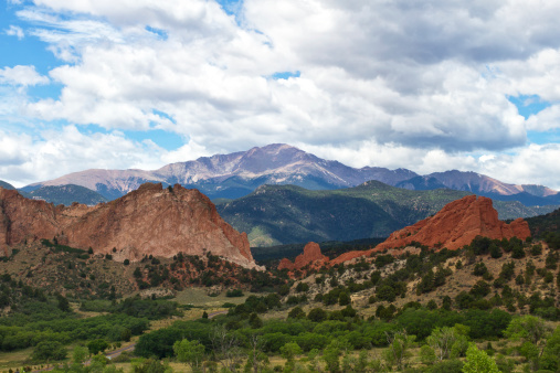 Pikes peak rises above garden of the Gods on a summer day in Colorado