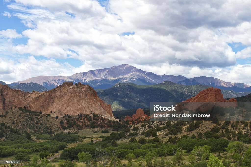 Pikes Peak on a summer day Pikes peak rises above garden of the Gods on a summer day in Colorado Pikes Peak National Forest Stock Photo
