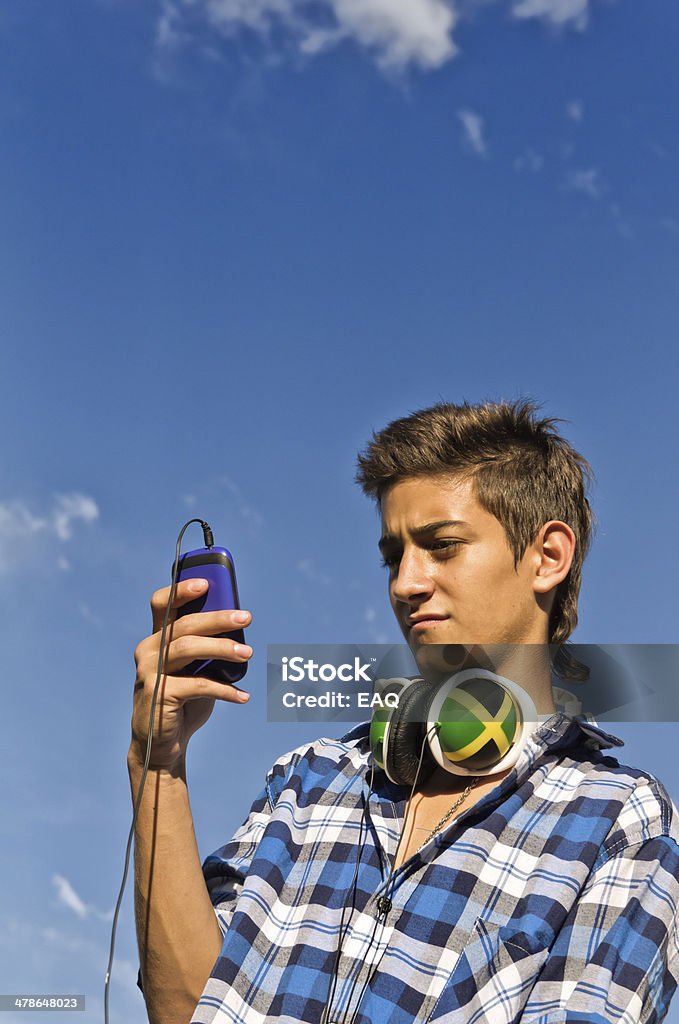 Teen with smartphone Teen in chatting, with your smartphone. 16-17 Years Stock Photo