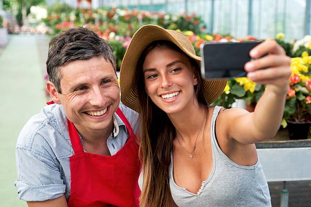 istock Couple Taking a Selfie in a Garden Center Store 478652014