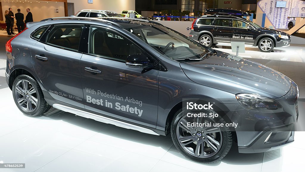 Volvo V40 Brussels, Belgium - January 14, 2014: Volvo S40 compact hatchback car on display at the 2014 Brussels motor show. People in the background are looking at the cars. 2014 Stock Photo