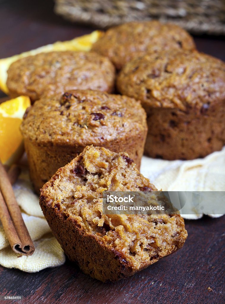 Carrot and marmalade muffins Carrot and marmalade muffins with cinnamon sticks and orange slices Muffin Stock Photo