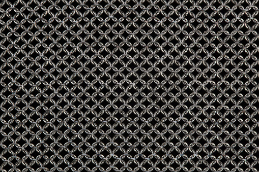 chain mail material against a black background