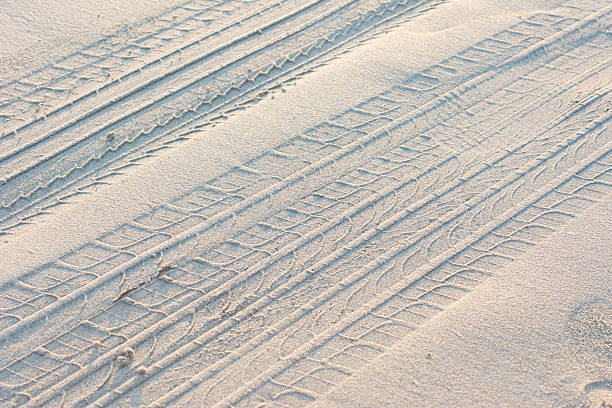 istock Tire from tracks on the sand texture background 478655472