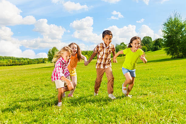 istock 6 ,7 years old kids running together 478656475