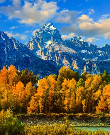 Autumn colors fill the valley below Grand Teton Peak along the Snake River, WY