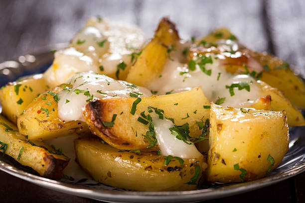 Baked potatoes with garlic stock photo