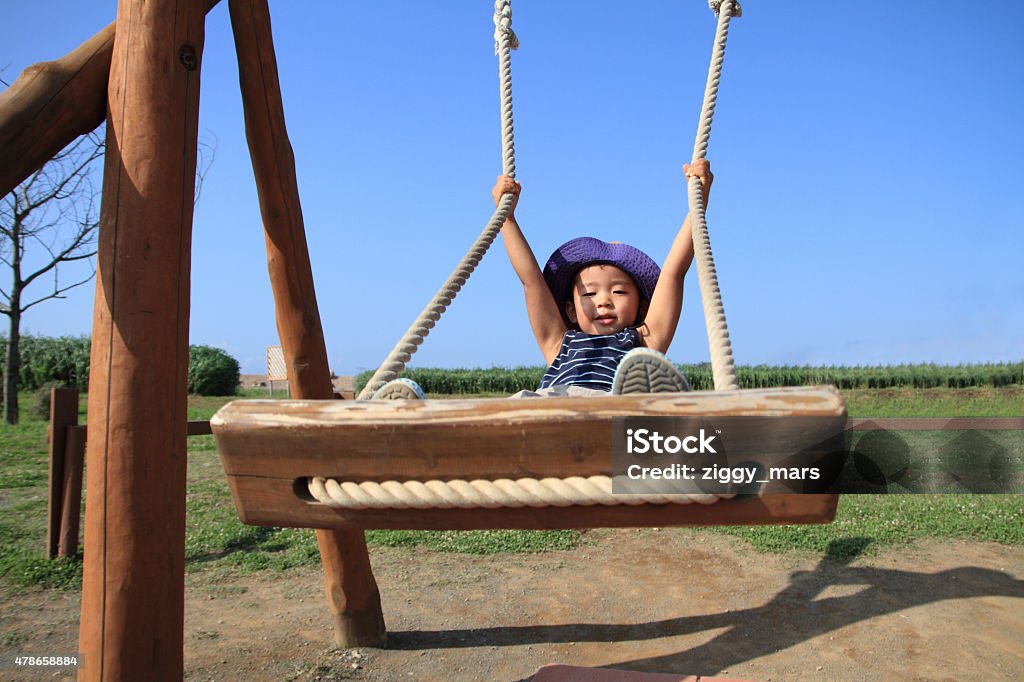 Japanese boy on the swing (3 years old) 2-3 Years Stock Photo