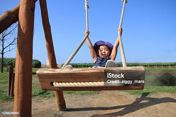 Japanese Boy On The Swing Stock Photo - Download Image Now - 2-3 Years, 2015, Adult