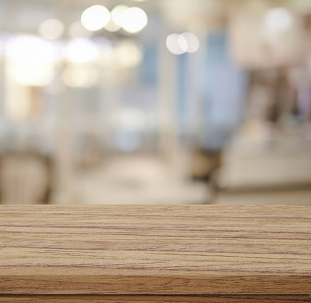istock Empty wood table and blurred cafe with bokeh light background 478660058