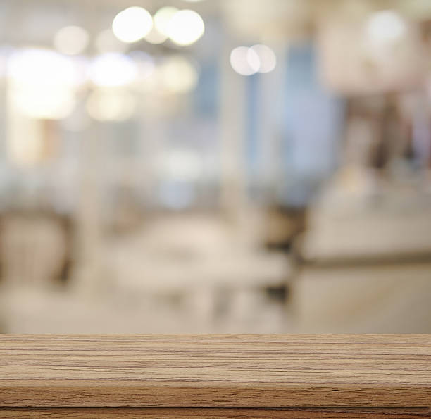 istock Empty wood table and blurred cafe with bokeh light background 478660060