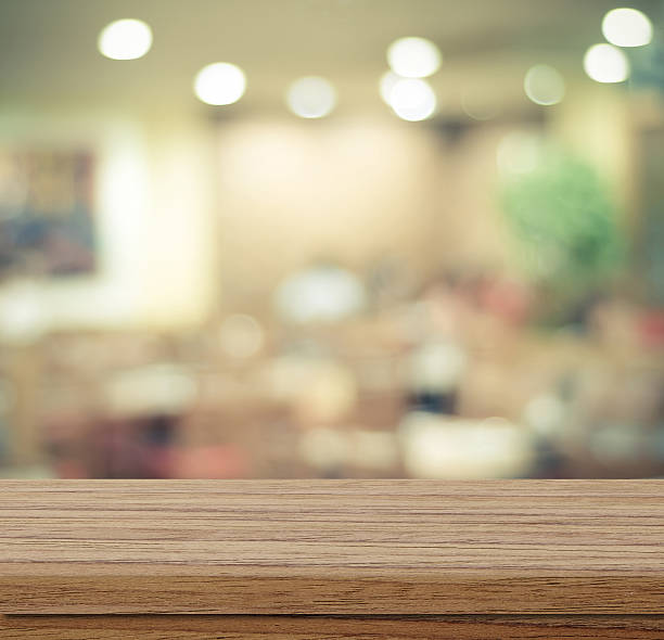 istock Empty wood table and blurred cafe with bokeh light background 478660066