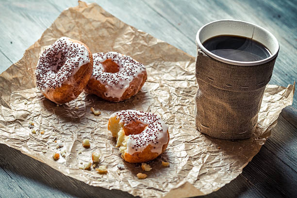 istock Closeup of hot coffee and donuts 478660659