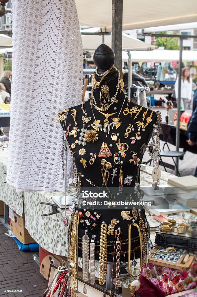 Decorated figure on antique market Decorated female  figure on antique market. Full with bracelets, brooches, earrings, necklaces and other jewelry Flea Market Stock Photo