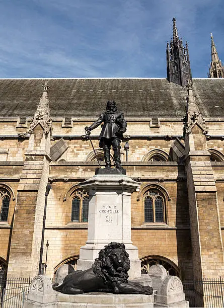 Statue of the Lord Protector Oliver Cromwell at the Houses of Parliament, Westminster, London. The statue was designed by Hamo Thornycroft and erected in 1899.