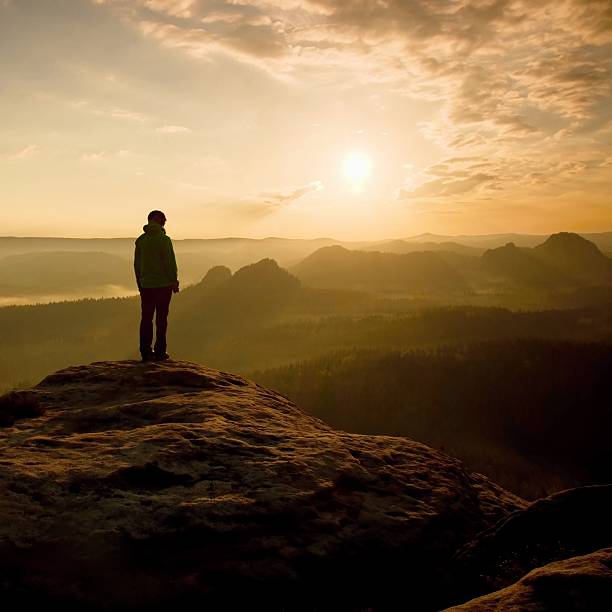 istock Hiker stand on the sharp corner of sandstone rock 478667338