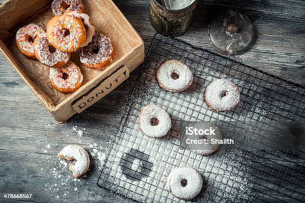 Tasting Freshly Baked Donuts Stock Photo - Download Image Now - Arrangement, Bakery, Black Color