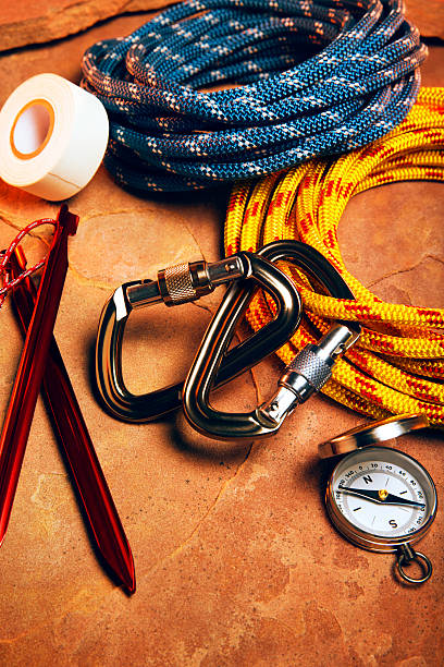 istock Carabiner Clips and Climbing Rope on Red Rock 478669056