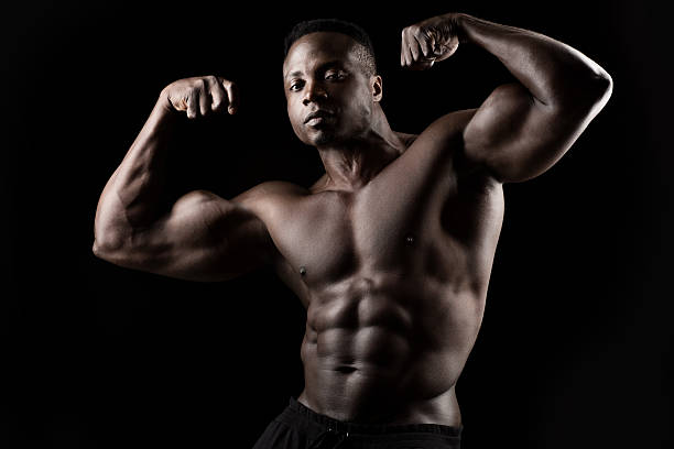 istock Black male posing with raised arms 478669522