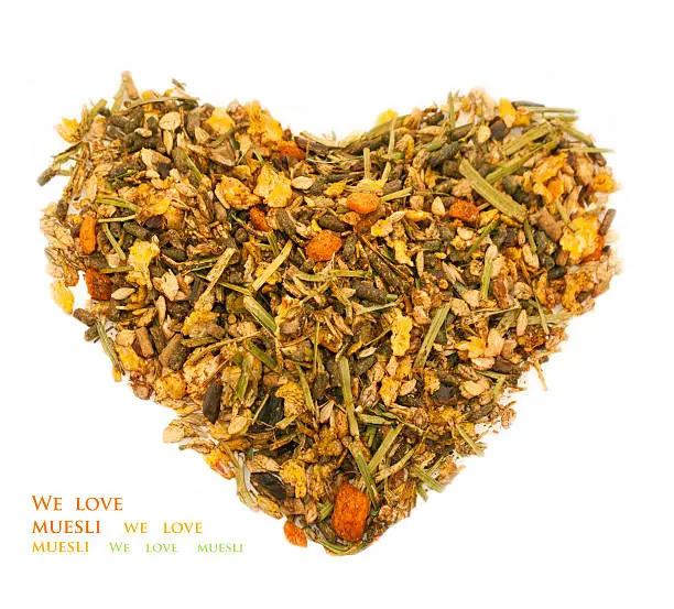 Photo of basic muesli  with herbs for horse. in form of heart