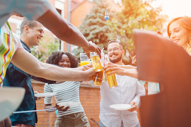 istock Happy Young People Toasting At Barbecue Party. 478671748