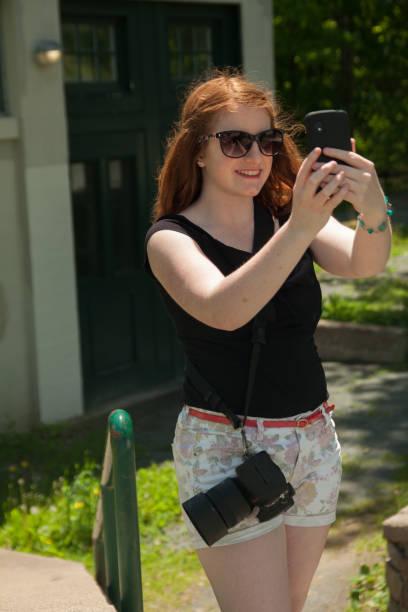 istock young woman taking a selfie on a summer day 478672336