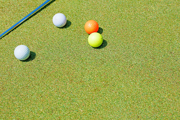 istock Golf ball and a fresh green lawn 478672854