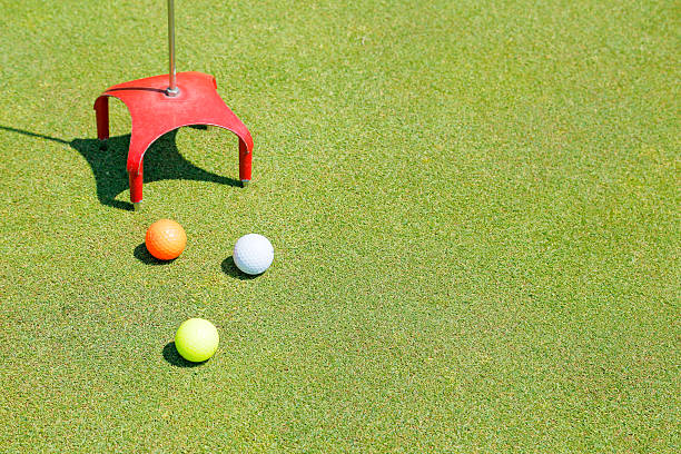 istock Golf ball and a fresh green lawn 478672860