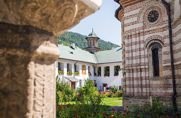 Cozia monastery church with visiting tourists stock photo