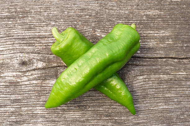 istock Ripe peppers on wooden background 478677976