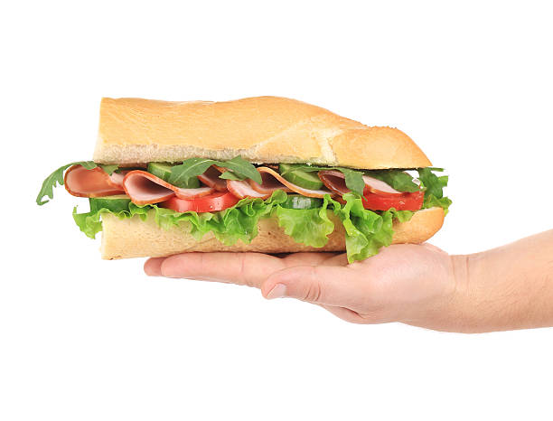 istock Baguette sandwich in hand. 478678619