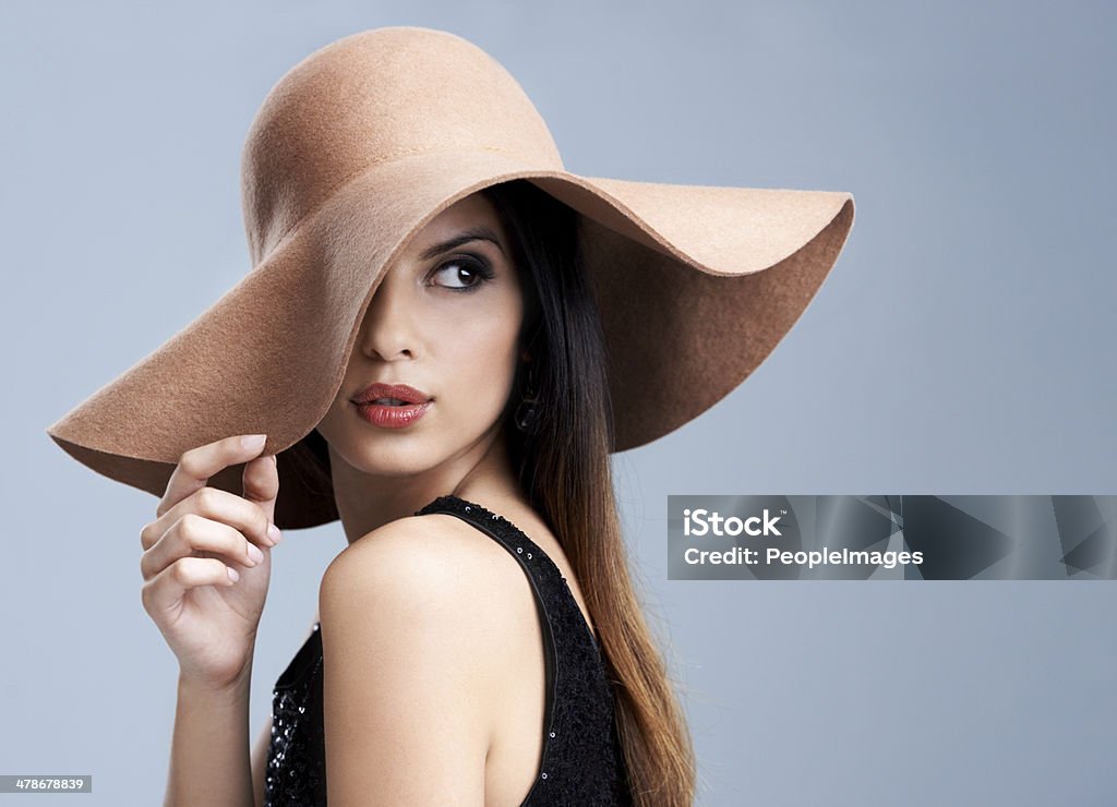 The epitome of gorgeous elegance Shot of a beautiful young woman modeling the latest fashions in studio Women Stock Photo