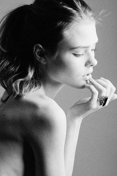 istock Beautiful young woman looking down 478686735
