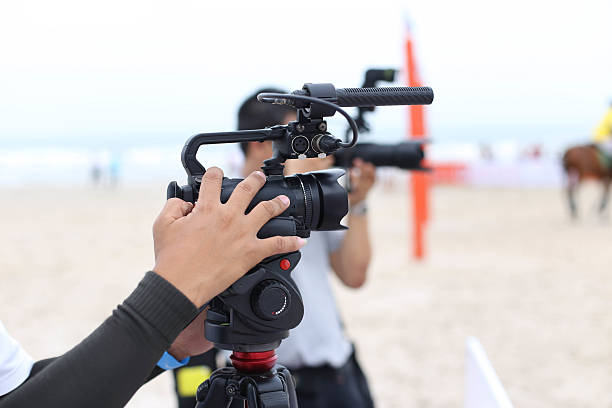 istock Cameraman working on recording on a beach Polo Tournament 478686784
