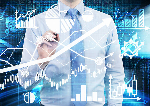istock Analyst is drawing financial calculations and predictions on glass screen. 478689948