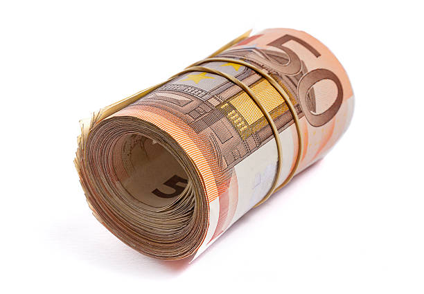 istock one 50 euro bank notes rolled and wrapped together. 478690542