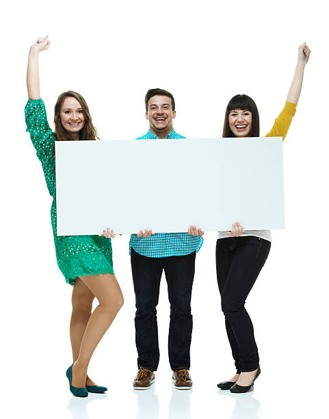 4,600+ 3 People Holding Sign Stock Photos, Pictures & Royalty-Free ...