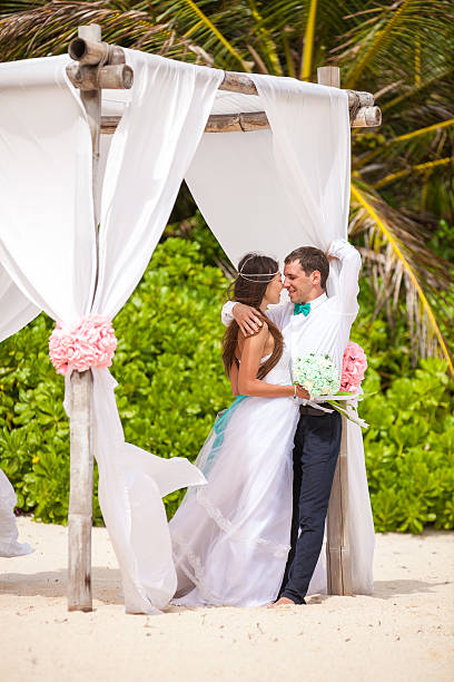 istock Young loving couple wedding in gazebo. 478694286
