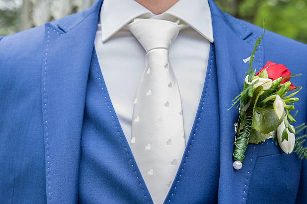 istock Groom with blue suit and white tie 478695488