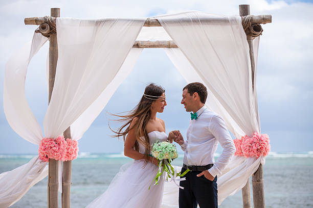 istock Young loving couple wedding in gazebo. 478695562